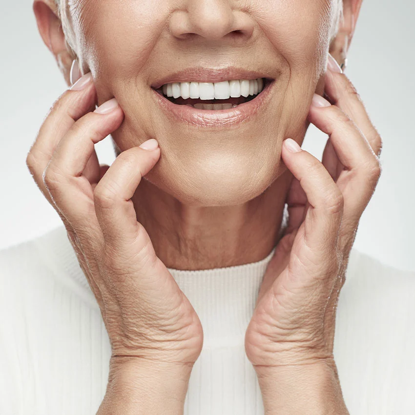 Patient smiling with all-on-4 dental implants in Woodland Hills, CA
